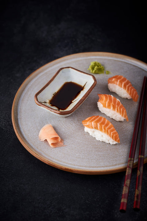 Nigiri sushi served with soy sauce