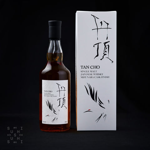Bottle of Tan Cho Single Malt Whiskey next to its box