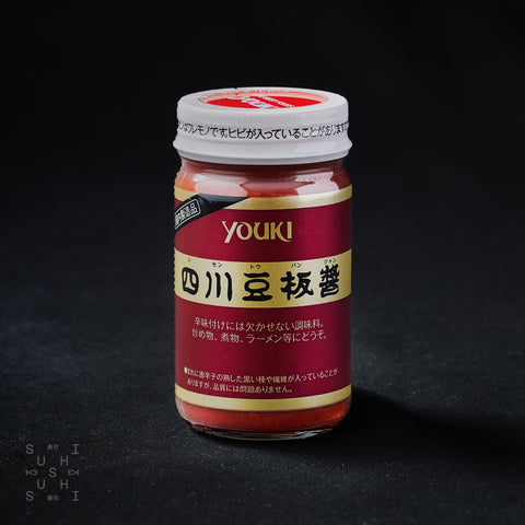 130g jar of chilli bean paste on a black background