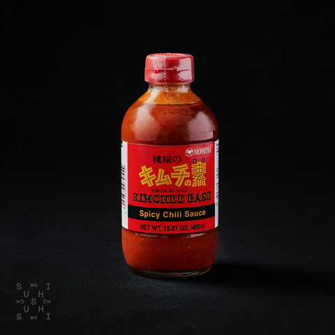 450ml bottle of kimchee base on a black background