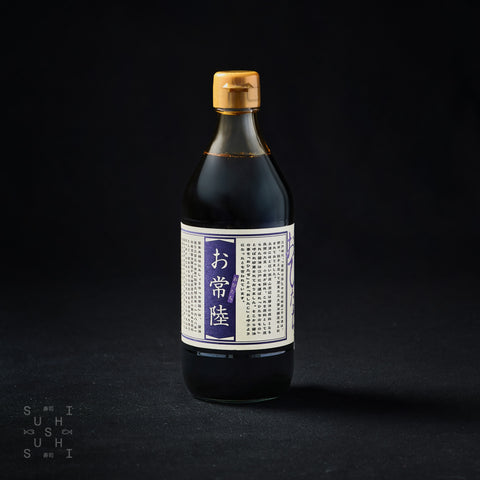500ml bottle of Ohitachi Raw Soy Sauce on a black background