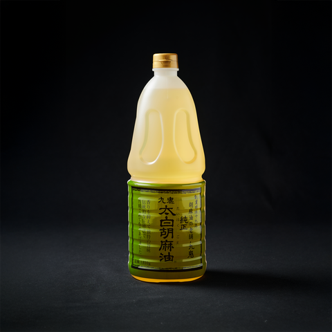 Bottle of unroasted sesame oil on black background