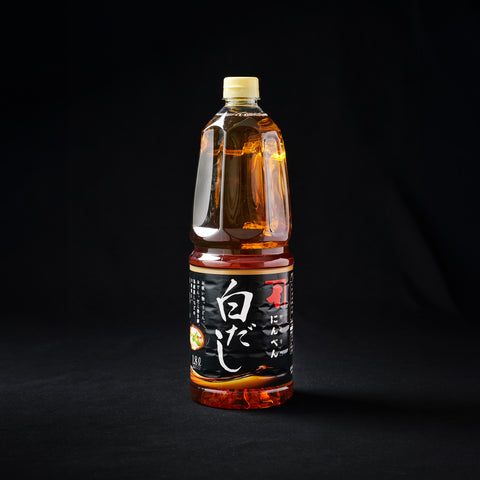 1.8L Bbottle of Shiro Dashi, Liquid Stock Concentrate on a black background