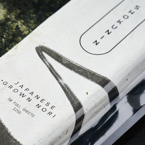 Close up of a pack of Nori sheets on a black background