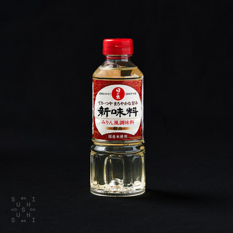 400ml bottle of Hinode Honteri low alcohol Mirin on a black background