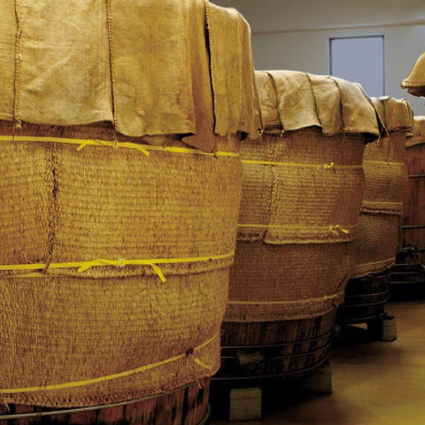 Insulated barrels of sushi vinegar in the distillery