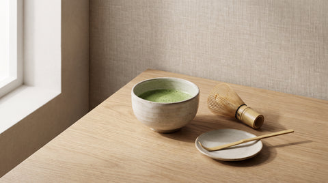 Matcha tea set with a bowl of whisked green tea