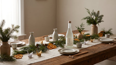 Christmas table styled with Japanese decorative elements and sake