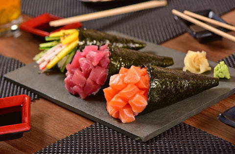 Selection of sushi types including maki, nigiri and temaki rolls