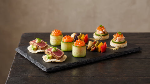 An elegant arrangement of small Japanese-style canapes, editorial food photography