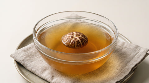 Clear bowl of shiitake mushroom dashi broth