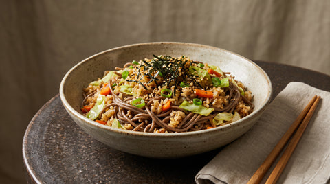 A bowl of soba meshi fried noodles and rice, editorial food photography