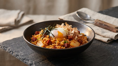 A bowl of chorizo fried rice with a Japanese-inspired twist, editorial food photography