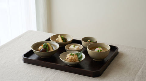 Refined Kyoto-style multi-course meal with seasonal vegetables and tofu