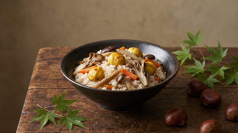 A seasonal autumn Japanese dish with chestnuts, mushrooms and root vegetables, editorial food photography