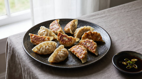 Pan-fried pork and vegetable gyoza dumplings with crispy bottoms