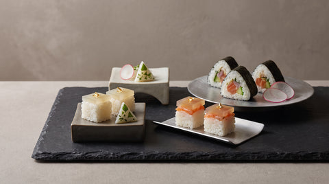 Modern minimalist sushi presentation with geometric garnishes
