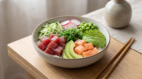 Vibrant poke bowl with cubed raw fish, rice and avocado