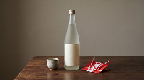 Bottle of Japanese sake with a celebratory paper decoration