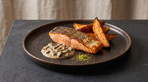 Seared salmon with sweet potato, yuzu pepper and creamy mushroom sauce, editorial food photography