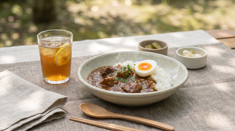 Bowl of Japanese curry with rice in a summer picnic setting