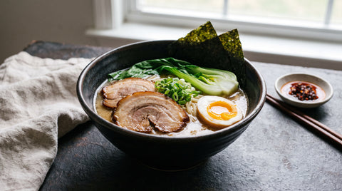 Rich bowl of pork ramen with chashu and soft-boiled egg