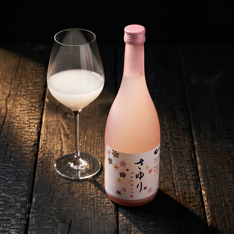 Hakutsuru Sayuri nigori sake bottle and pour, creamy cloudy texture