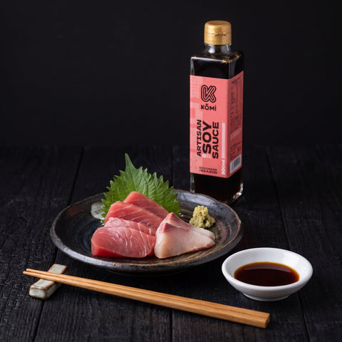 Tuna and yellowtail sashimi with a dish of Kōmi Artisan soy sauce, 300ml bottle behind