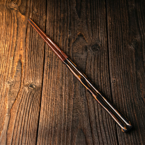 Wooden chopsticks on a rustic wooden surface