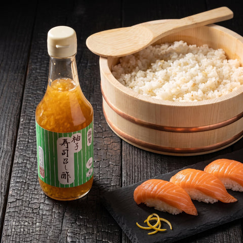 Saika, Yuzu Sushi Vinegar, Seasoned Rice Vinegar with Yuzu Citrus, 300ml, with sushi rice in a hangiri and salmon nigiri