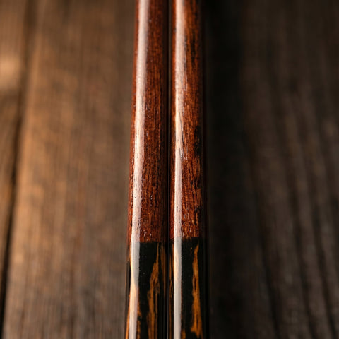 Close-up of wooden japanese chopsticks with a focus on the grain and texture.