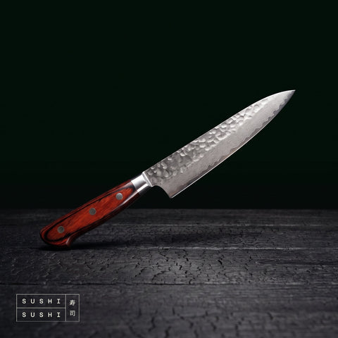 Sakai Takayuki 33 layer Damascus petty knife 150mm on charred black timber