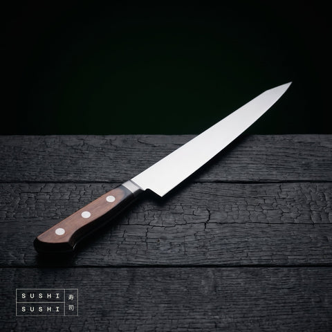 Sakai Takayuki TUS sashimi knife 240mm on charred black timber