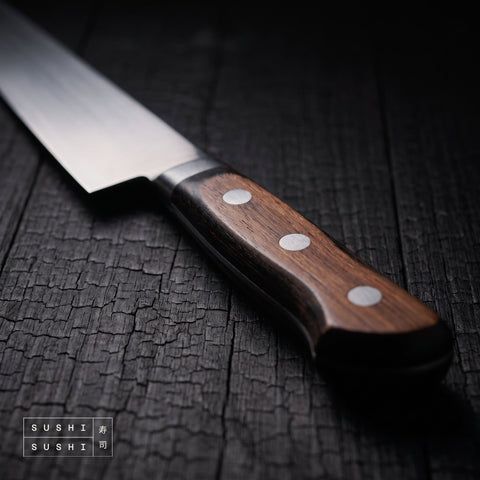 Close-up of the riveted handle of the Sakai Takayuki TUS 240mm sashimi knife