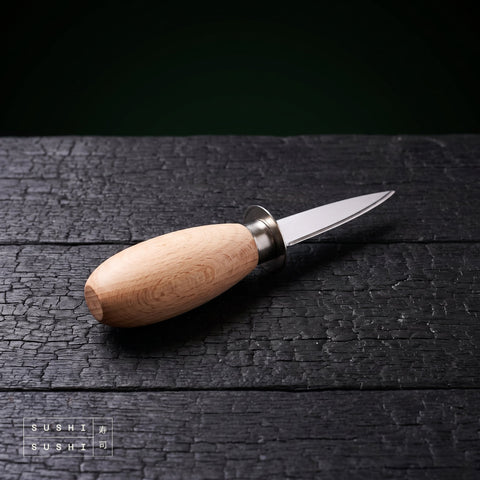 Sakai Takayuki oyster opening knife 150mm on charred black timber
