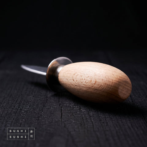 Close-up of the wooden handle and guard of the Sakai Takayuki oyster opening knife