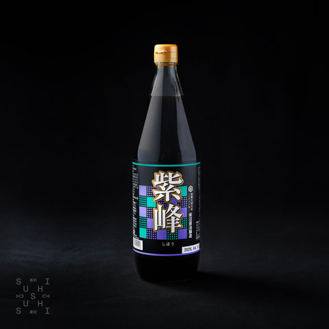 1L bottle of 2 year aged soy sauce with dashi on a clack background