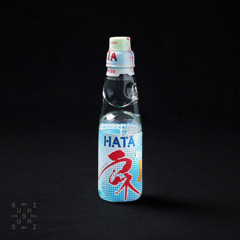 200ml bottle of original Hatakosen, Ramune Soda on a black background