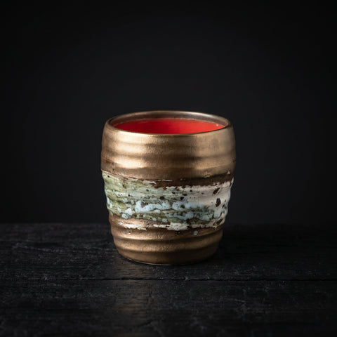 Japanese rustic ceramic cup with gold glaze, handleless tea and sake cup
