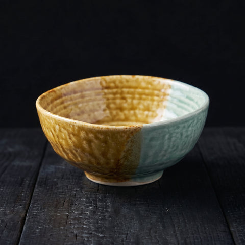 Mustard-yellow and teal two-tone triangular-rim bowl