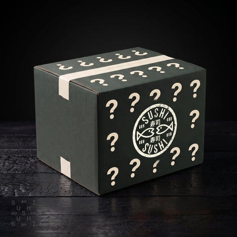 SushiSushi Restaurant mystery box worth £300 sealed catering box with question marks, three-quarter view on dark wood