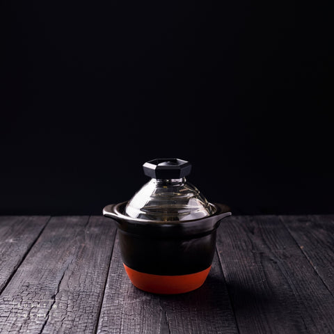 Hario, Rice Cooker, Small, ceramic rice cooker on a charred shou sugi ban wooden surface against a black background