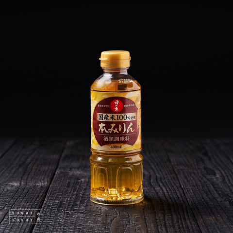 Hinode, Hon Mirin, 400ml, bottle on a charred shou sugi ban wooden surface against a black background