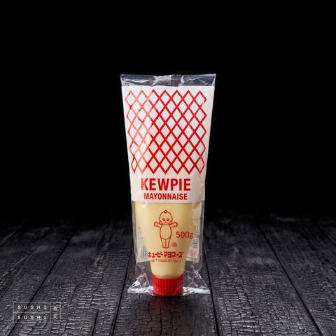 Kewpie, Mayonnaise, 450g, bottle in its bag on charred shou sugi ban wood against a black background