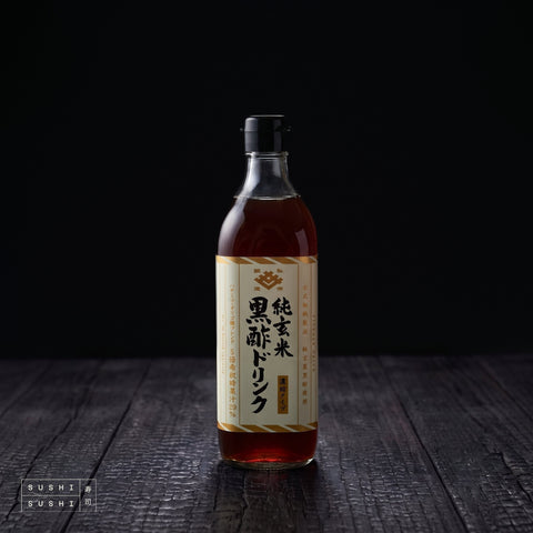 Kisaichi, Sweet Koji, Apple and Black Vinegar, 500ml, bottle on a charred shou sugi ban wooden surface against a black background