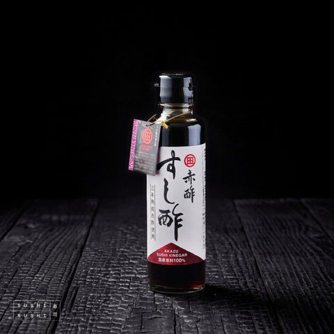 Kono, Sweet Akasu Vinegar, 150ml, bottle on charred shou sugi ban wood against a black background