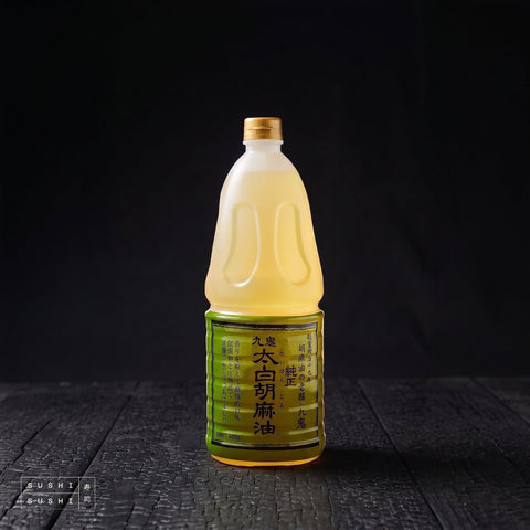 Kuki, Unroasted Sesame Oil, 1.65kg, bottle on charred shou sugi ban wood