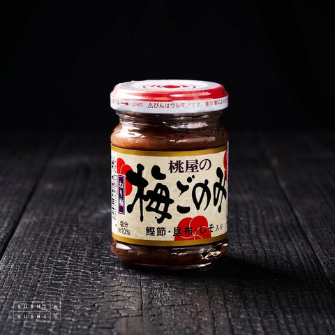 Momoya, Umeboshi Paste with Dashi, 105g, jar on charred wood