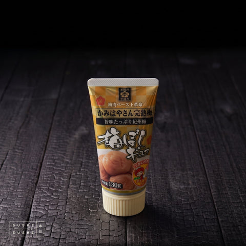 Okahata, Ripe Umeboshi Paste, 130g, tube on charred shou sugi ban wood against a black backdrop