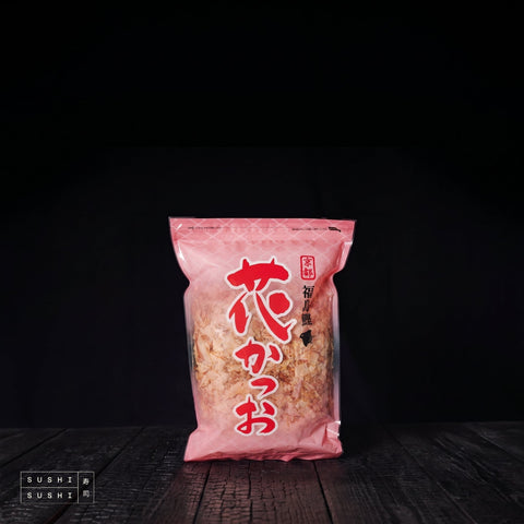 Okan, Bonito Flakes (Katsuobushi), 500g, bag on charred shou sugi ban wood against a black backdrop